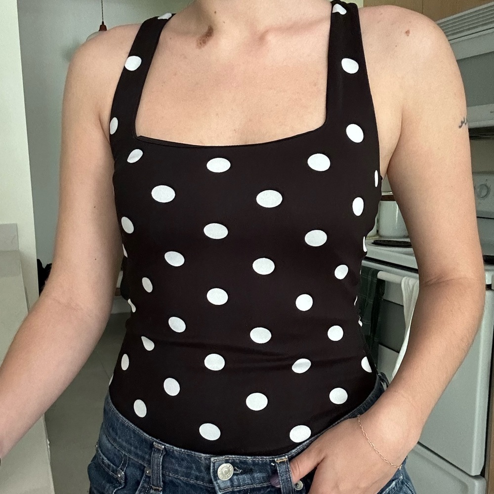 Black polka dot body suit